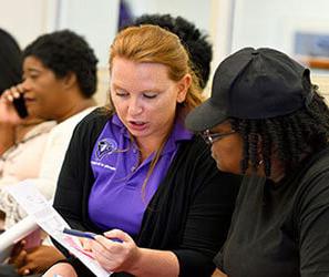 UB Financial Aid staff member working with a student